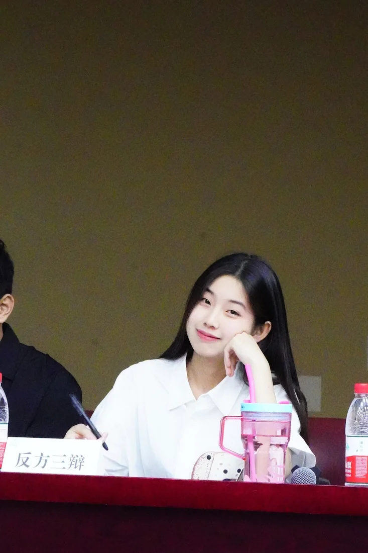 Lu Jiayi at a debate table