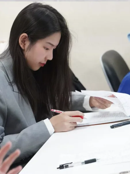 Lu Jiayi preparing debate notes